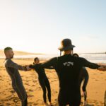 Intermediate surfer doing bottom turn Morocco Taghazout wave