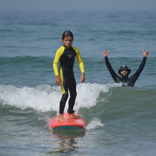 First surf lesson for beginners Tamraght beach Morocco